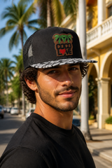 Man wearing Coco Love trucker hat on a palm-lined street