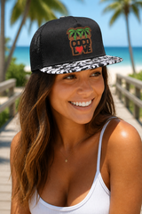 Couple wearing matching Coco Love trucker hats at a festival